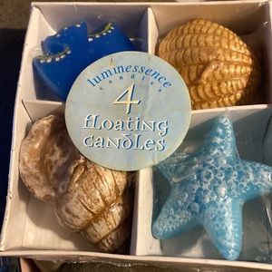 New sealed luminescence 4 floating candles. Fish, shells, and Star fish